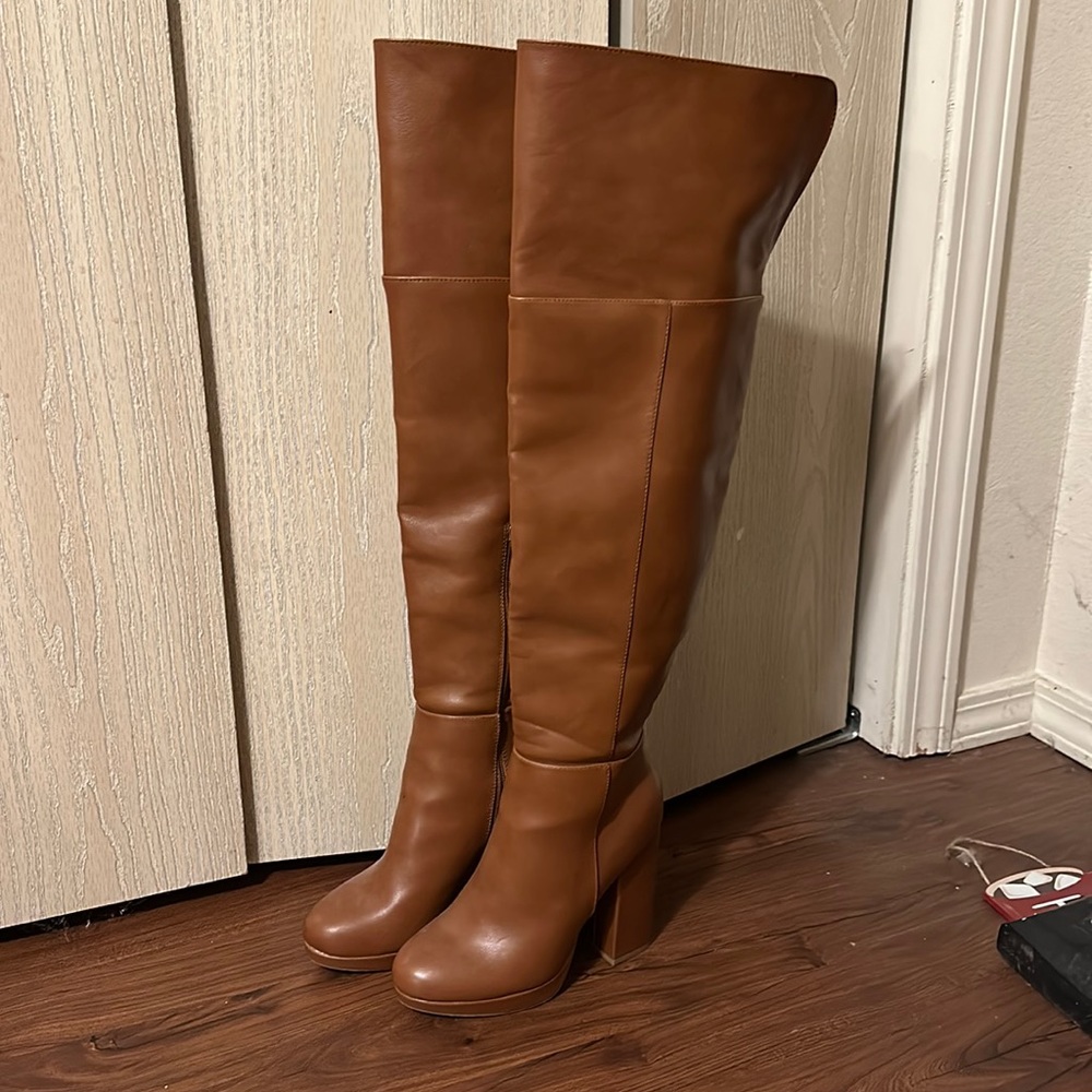 Like new shoe dazzle heeled over the knee boots to small for me.